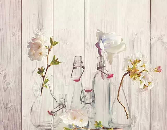 Glass vases with flowers before editing