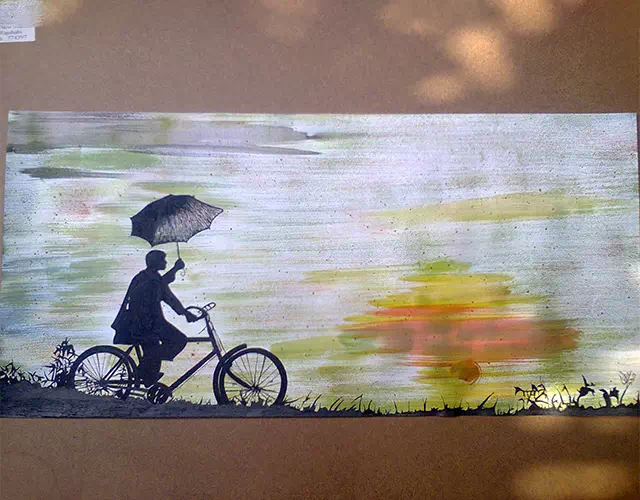 Painted image of a child cycling against a soft, blurred background