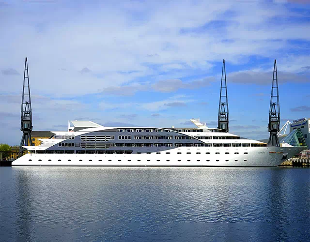 Photograph of a large white yacht in a harbor
