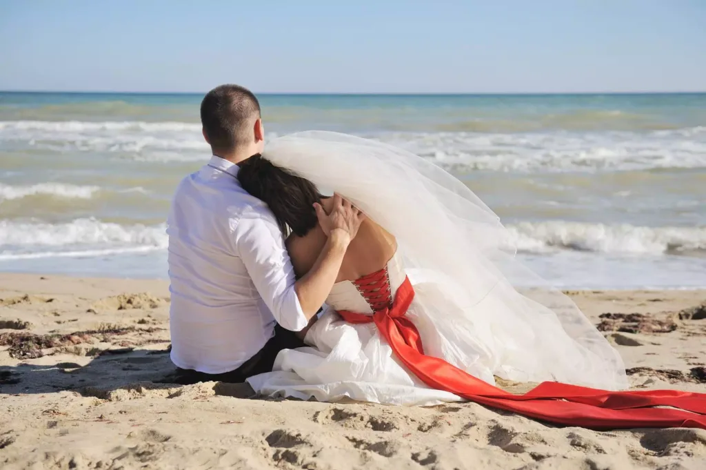 Bride Resting Her Head Against Groom’s Shoulder