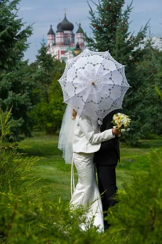 hiding behind umbrella