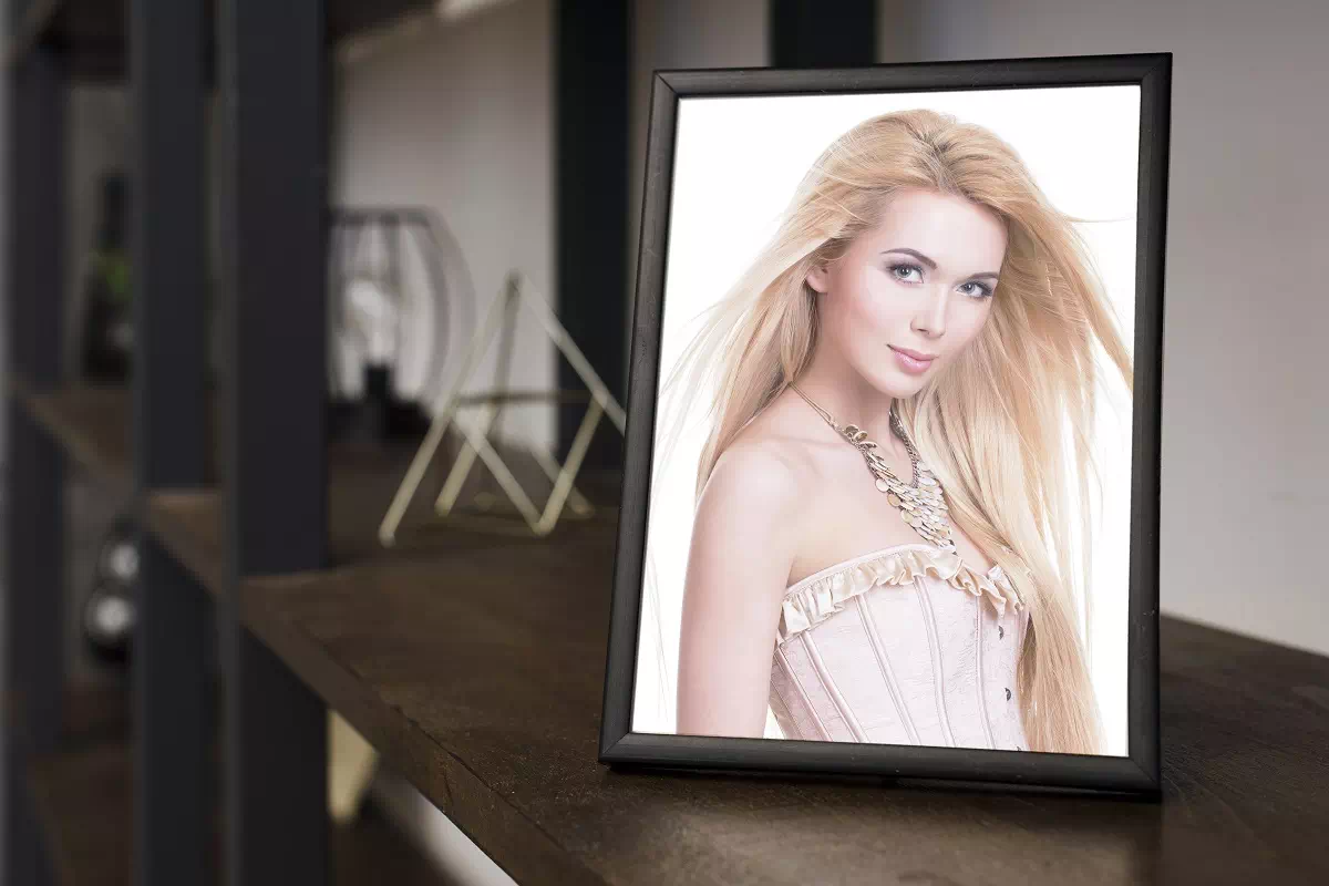 Retouched portrait shown in a picture frame