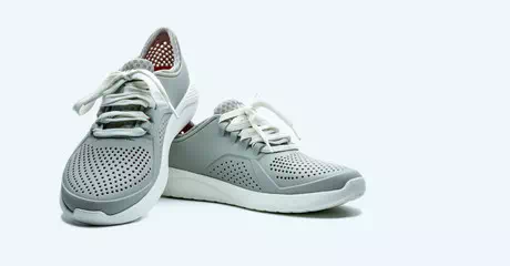 Gray running shoe edited on a white background