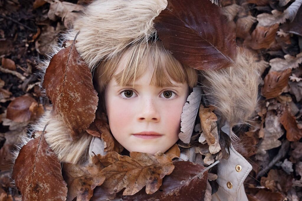 Kids with autumn leaves - Vector Design US, Inc Kids with autumn leaves