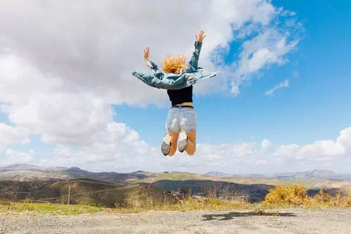 Jumping in the Air with Arms Raised Jumping in the Air with Arms Raised