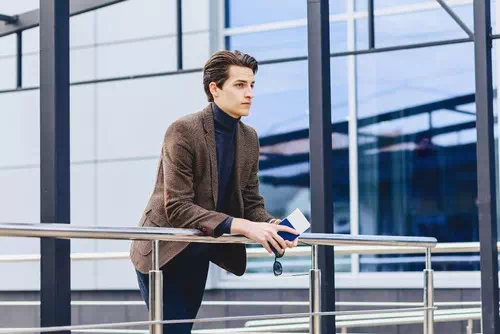Leaning on a Railing with a Serious Look Leaning on a Railing with a Serious Look