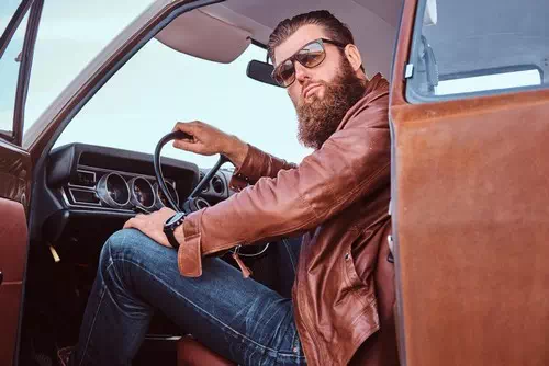 Leaning on a Vintage Car with a Serious Look Leaning on a Vintage Car with a Serious Look