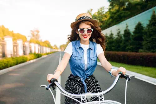 Sitting on a Bicycle with a Joyful Smile Sitting on a Bicycle with a Joyful Smile