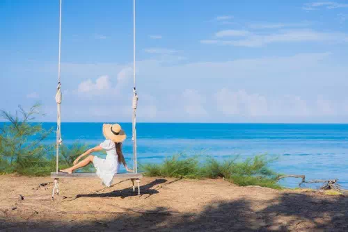 Sitting on a Swing with a Dreamy Expression Sitting on a Swing with a Dreamy Expression