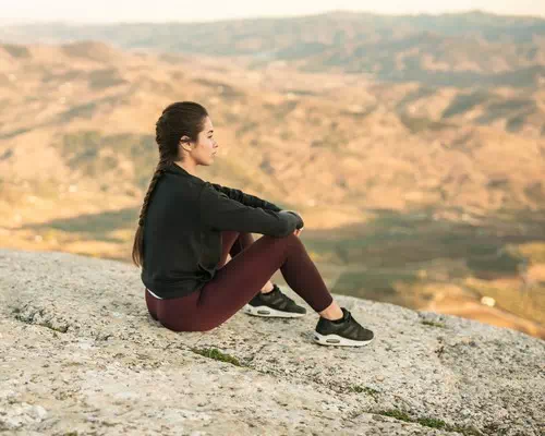 sitting with Legs Stretched Out and Looking into the Distance sitting with Legs Stretched Out and Looking into the Distance